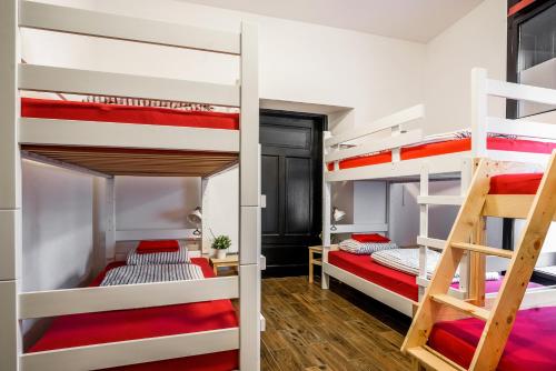 a bedroom with bunk beds in a hostel at Turn Hostel in Ljubljana