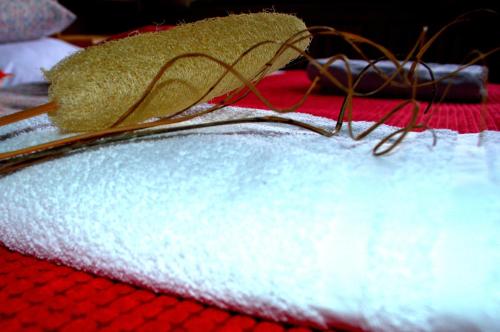 a pile of towels on top of a red table at Haus Susanne in Radstadt