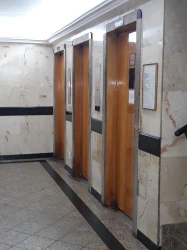 a row of wooden doors in a subway station at Apartamento de Férias Copacabana Rio de Janeiro in Rio de Janeiro
