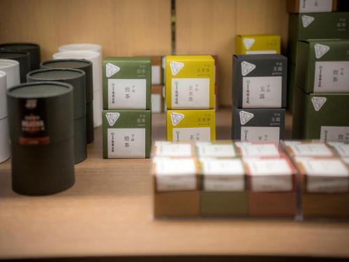 a row of boxes sitting on a table next to a keyboard at Saka Hotel Kyoto in Kyoto