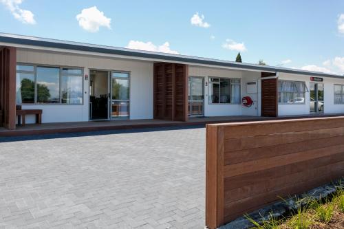 a rendering of a house with a fence at eMotel in Taupo