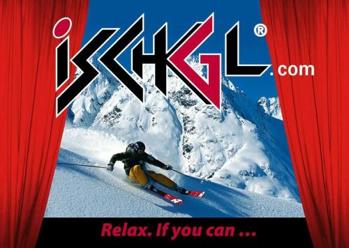a man is skiing down a snow covered mountain at Sport Garni Kapplerhof – Ischgl/Kappl in Kappl