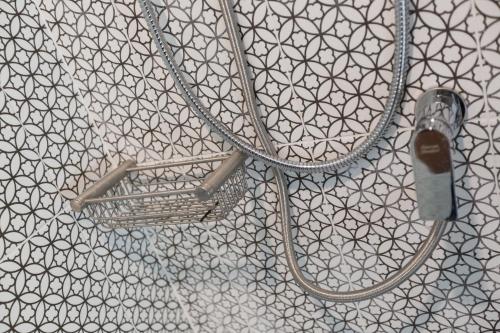a hose is hooked up to a wall at Merchant House Chiangmai in Chiang Mai