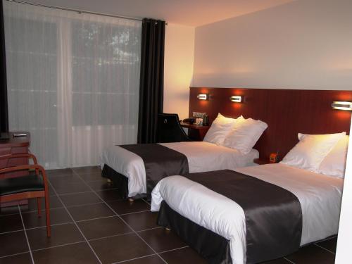 Säng eller sängar i ett rum på Hostellerie Del Matin Calme