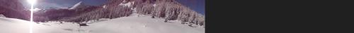 a snow covered mountain with trees on it at Hotel Albe in Rocca Pietore