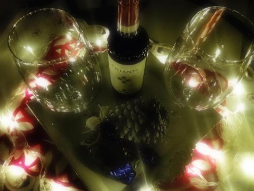 a table with a bottle of wine and two wine glasses at Il Rosciolo Sulla Francigena in Formello