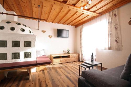 a living room with a couch and a table at Almliesl ZELL-448 in Zell am See