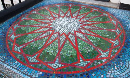a mosaic tile floor with a flower on it at St Athans Hotel in London
