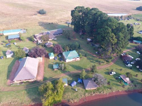 an aerial view of a farm with a group of buildings at Elandskloof Trout Farm in Dullstroom