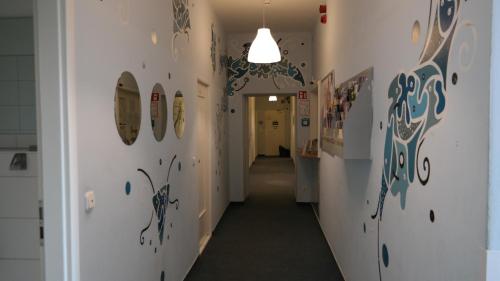 a hallway with surfboards on the walls of a room at Hostel Inn-Berlin in Berlin