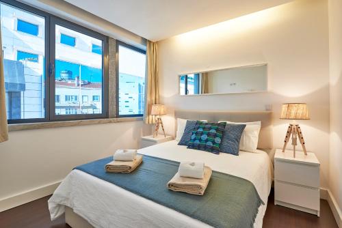 Modern Apartment Marquês tesisinde bir odada yatak veya yataklar
