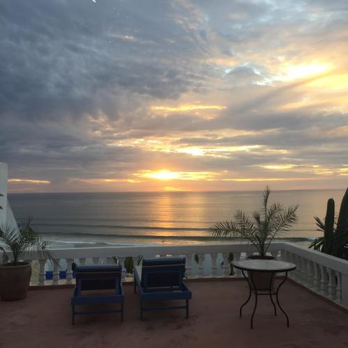a view of the ocean from the balcony of a resort at Villa Jardin De l'Ocean in Aourir