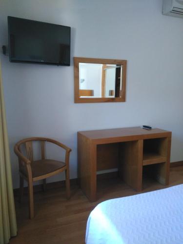 TV a/nebo společenská místnost v ubytování Dom Hotel