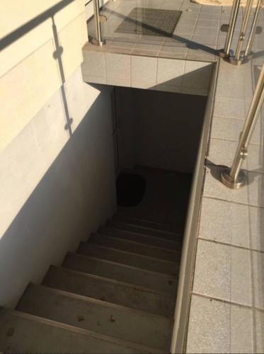 a staircase in a building with a tunnel in the floor at Einliegerwohnung Kleinmachnow in Kleinmachnow