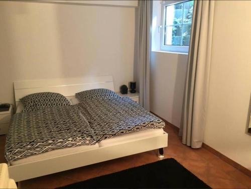 Кровать или кровати в номере Einliegerwohnung Kleinmachnow