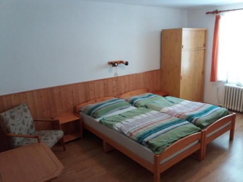 Postel nebo postele na pokoji v ubytování U Nás - Apartmán Jelen