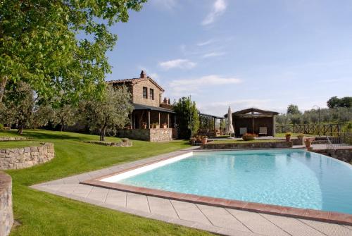 a swimming pool in the yard of a house at Special and Nice close to the Chianti in Bucine