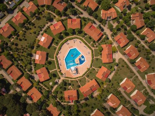 an overhead view of a pool in a suburb at Victoria Mobilehome BI VILLAGE in Fažana