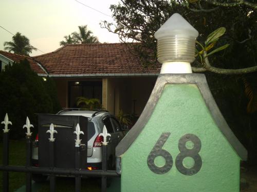 a green house with a light on top of it at Mama's Hostel by Taprobane in Negombo