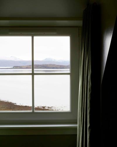 a window in a room with a view of the ocean at Kinloch Lodge Hotel and Restaurant in Kinloch