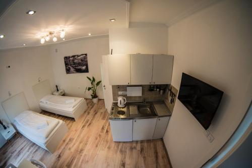 an overhead view of a kitchen and a living room at Apartments Pia in Subotica