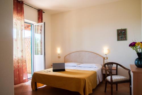 En eller flere senger på et rom på Villa Pietra Verde