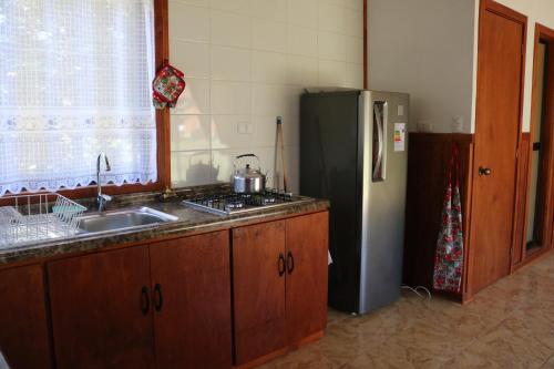 Dapur atau dapur kecil di Cabañas Pun May
