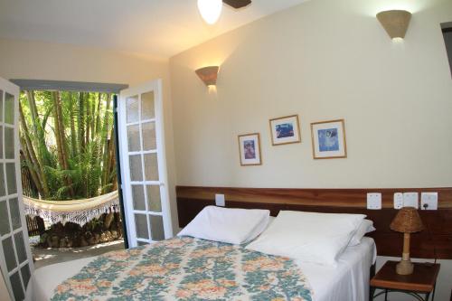 Un pat sau paturi într-o cameră la Vivendas do Morro Verde