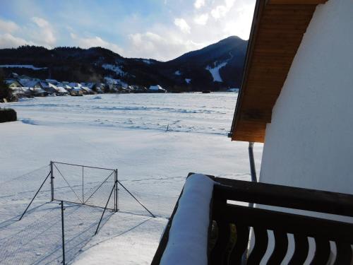 a room with a view of a snow covered field at Apartmany Tania in Závažná Poruba