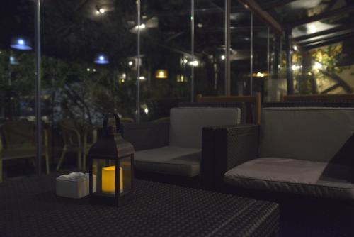a candle in a bottle sitting on a table at Hotel Gastronómico Casa Rosalia in Brion