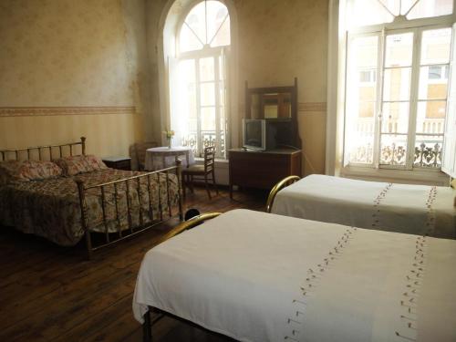 Llit o llits en una habitació de Hotel Garden