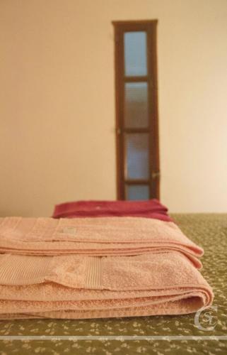 a bed with a ladder in the corner of a room at Cabañeros San Luis in San Roque