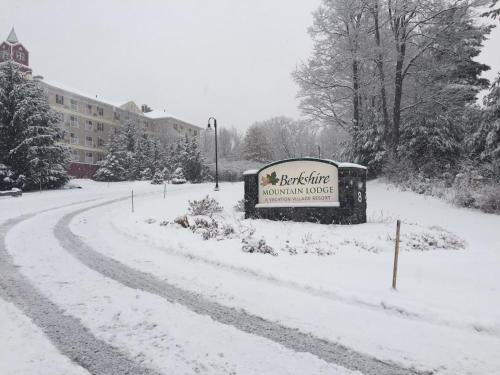 a sign for the burlington mountain house in the snow at Berkshire Mountain Lodge in Pittsfield