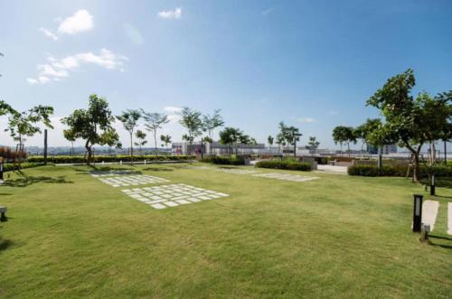a park with benches and a grass field at 34 Studio at Trefoil Setia Alam in Shah Alam