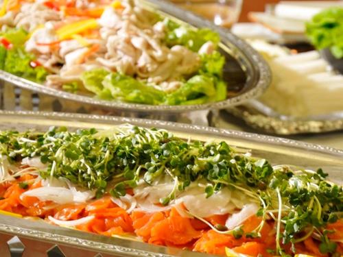 a plate of food with vegetables and greens on it at Ikaho Grand Hotel in Shibukawa