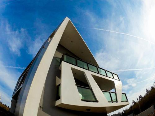 a building with a geometric design on top of it at Noah's Ark Homestay in Huxi
