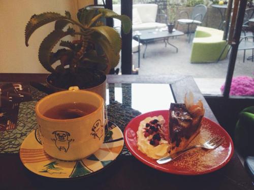 a cup of coffee and a plate of food on a table at B&b Arco Etrusco in Perugia