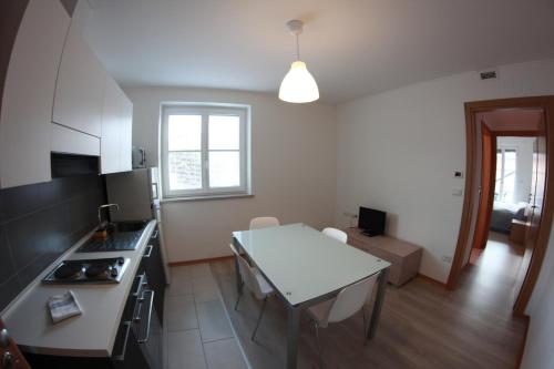 a kitchen with a table and a counter top at Residence Villa Susy in Duino
