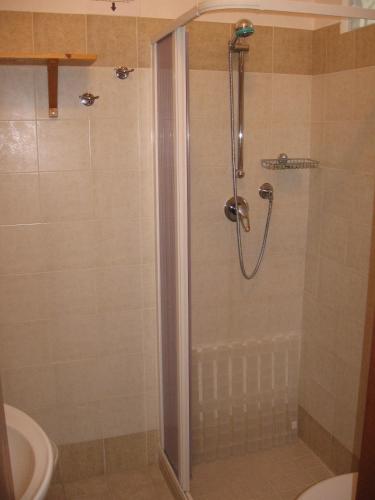 a shower with a glass door in a bathroom at Giogaia in Modica