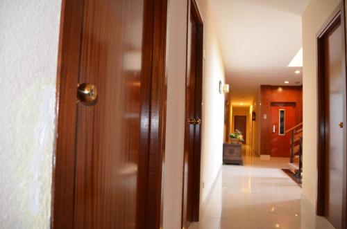 a hallway with a door leading to a room with a door leading to a at Hotel Sant Jordi in Tarragona