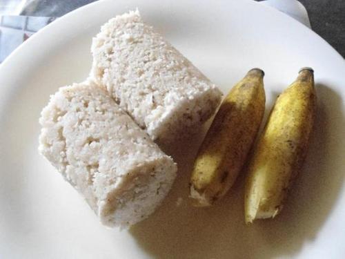 two pieces of bread and two bananas on a white plate at KTDC Bolgatty Palace & Island Resort in Cochin