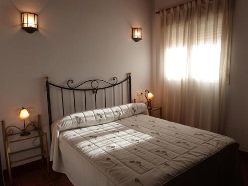Hostal Restaurante Las Canteras tesisinde bir odada yatak veya yataklar