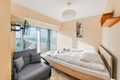 Posteľ alebo postele v izbe v ubytovaní Apartamenty Sun & Snow Wechta - Promenada Gwiazd z sauną