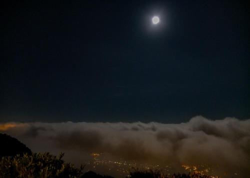 a view of the moon over the clouds at Domaine du Bois d'Amont in Cabris