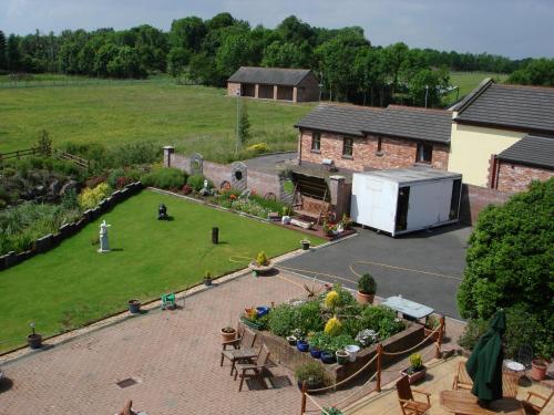 an aerial view of a garden and a house at The Stables B&B in Antrim