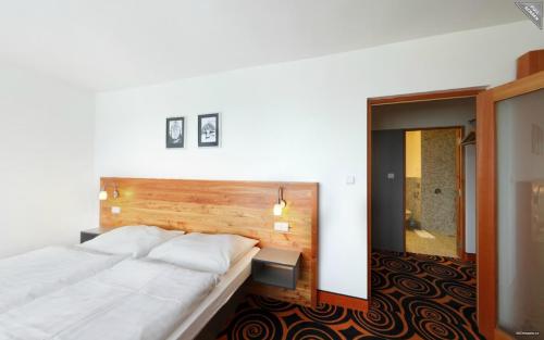 Voodi või voodid majutusasutuse Hotel Duo toas