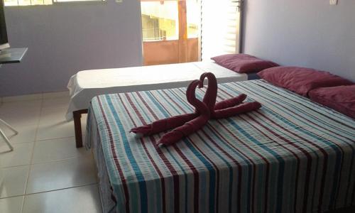 Cama ou camas em um quarto em Pousada Ana Raio