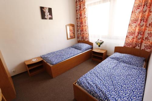 Hotel Telgárt - Turistické ubytovanie tesisinde bir odada yatak veya yataklar