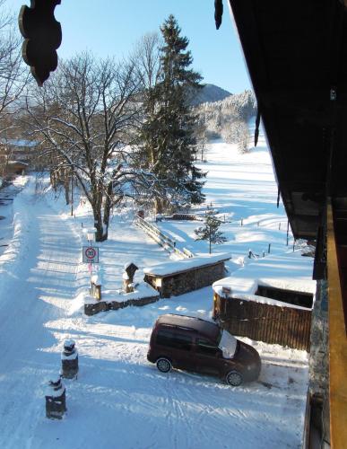 a car parked in a snow covered yard at Haus Christoph in Bad Wiessee