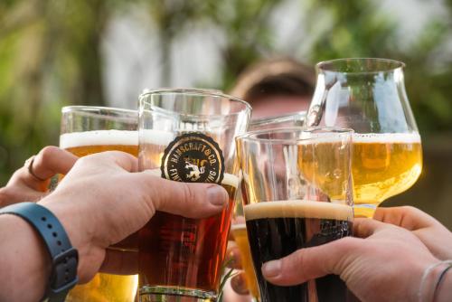 a group of people holding glasses of beer at Ko´Ono Hotel in Konstanz